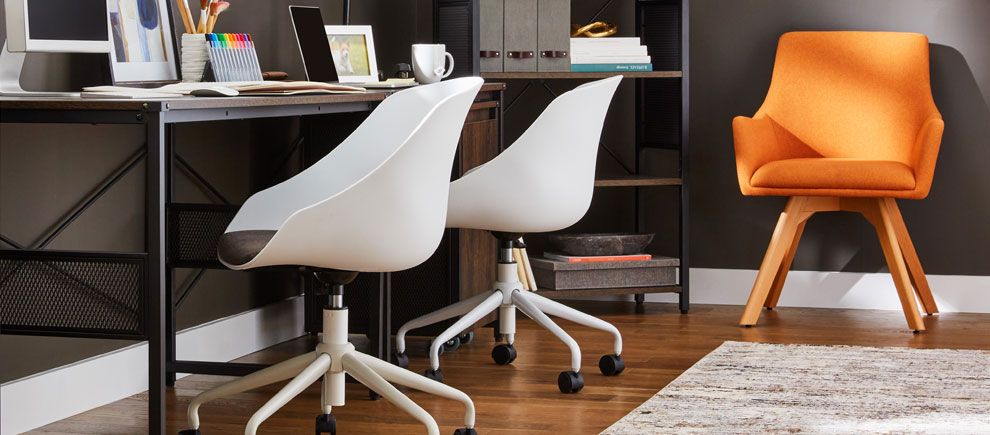 Contemporary orange office chair with two armless white office chairs in front of conference table. 
